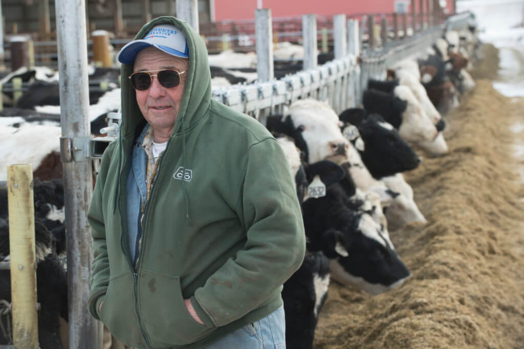 Farmer Wayne Kieffer feeds his herd of 400 dairy cattle on his fifth-generation farm near Hastings, Minn.